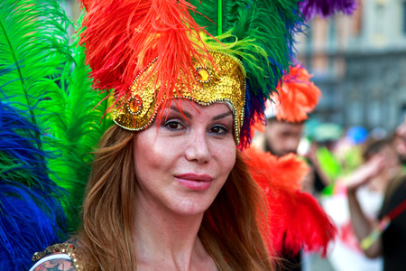 A partecipant with colored plumage in the Naples Gay Pride Parade.のeditorial素材
