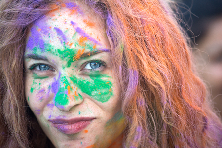 Young woman covered with color powder while celebrating the Holi Festival in Naplesのeditorial素材