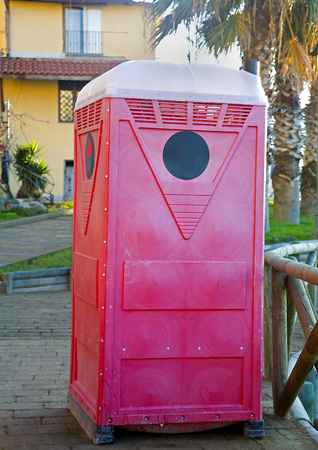 View of a red and white Portable toiletteの写真素材