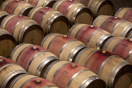 Wooden barrels in a cellarの写真素材