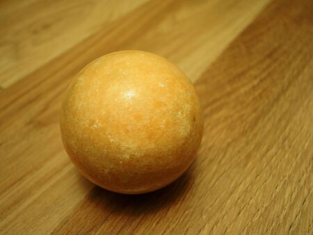 brown ball on parquet tilesの写真素材