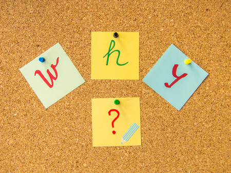 Cork board why written with pinned post itの写真素材