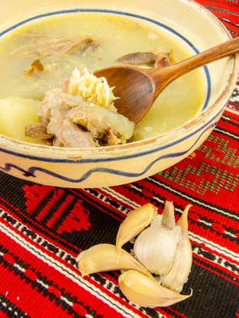 traditional romanian gourmet chicken jelly with cloves of garlic and horseradishの写真素材