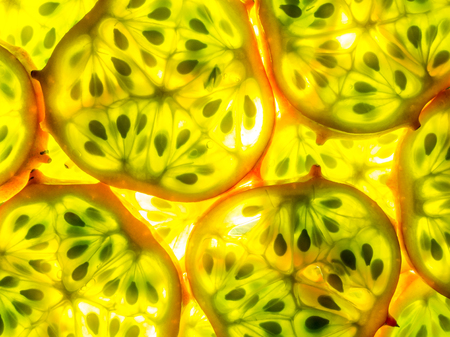 texture of kiwano melano slices arranged back litの写真素材