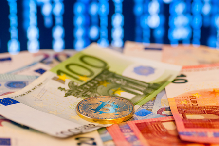 bitcoin concept coin and euro over digital wallpaperの写真素材