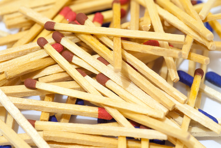 match sticks spread on white paper abstract conceptの写真素材