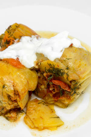 delicious red bell peppers stuffed with minced meat on white plate