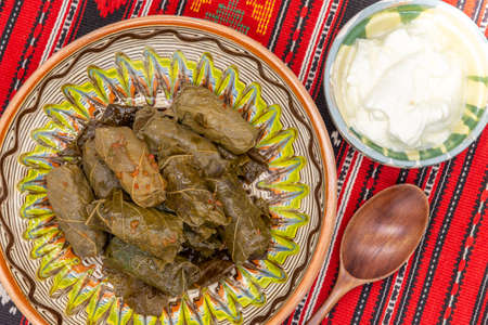 wine leafs rolls stuffed with meat and vegetables or just rice and vegetables romanian dish of...