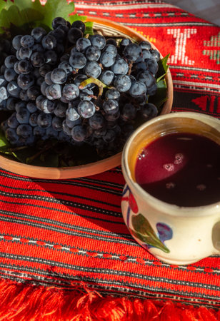 mug with stum and grapes nearの写真素材
