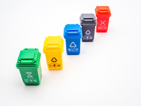 various colored recycle bins for different type of trash on white, recycling environment protection conceptの写真素材