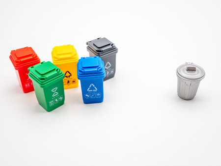 various colored recycle bins for different type of trash on white, recycling environment protection conceptの写真素材