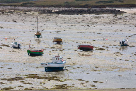 Stranded fishing boats a low tide.のeditorial素材
