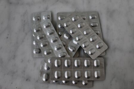 blister with tablets on the tableの写真素材