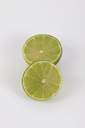 two half limones on the tableの写真素材