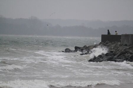 Waves at the pier at the east sea in germanyの写真素材