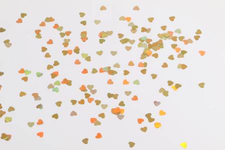 golden decoration hearts lying in the studio