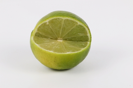 slices of lime is lying in the studioの写真素材