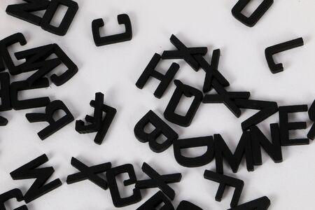 black wooden letters lying in the studioの写真素材