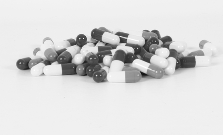 Heap of capsules in the studio black and whiteの写真素材