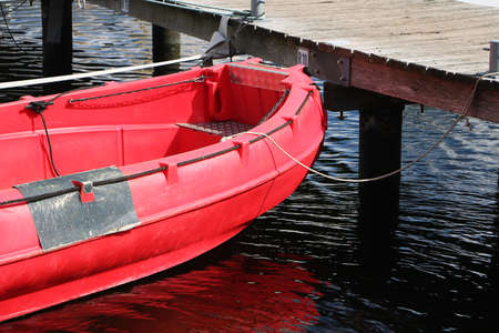 close up of a small red dinghyの写真素材
