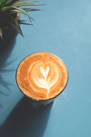 a glass of latte coffeeの写真素材