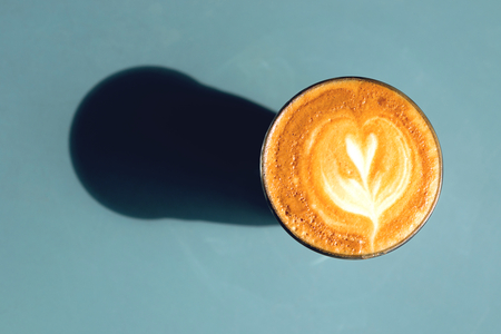 a glass of latte coffeeの写真素材