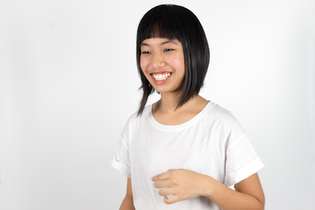 Young beautiful asian teenage girl isolated against white backgroundの写真素材