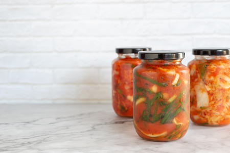 homemade green onion kimchi in a glass jarの写真素材