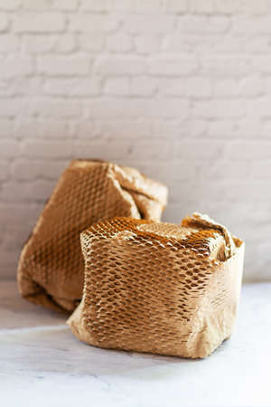 eco friendly honeycomb wrapping paper for packaging, a block of sustainable wrapping paper on marble...