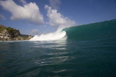 wave breaking at padang padang beach on the bukit peninsula in Bali, Indonesiaの写真素材