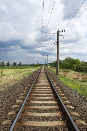 Straight railway leads to the horizon の写真素材