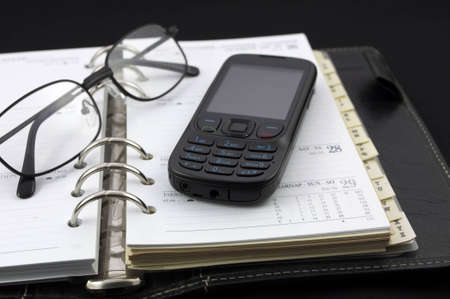 Personal diary and mobile phone の写真素材