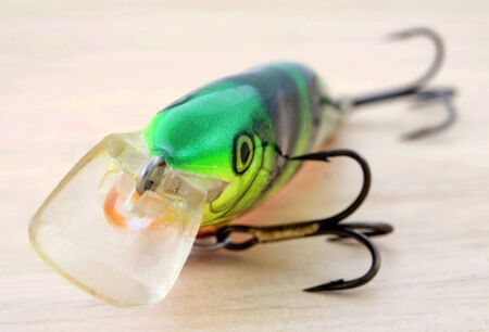 Perch pattern wobbler on wooden deskの写真素材