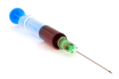 Syringe with blood isolatedの写真素材