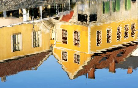 Reflection of houses in pond of Tapolca, Hungaryの写真素材