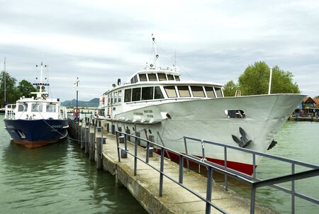 Heviz passenger ship and a police ship in the port of Fonyod at Lake Balaton on 26. April 2018, Hungaryのeditorial素材