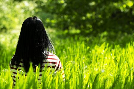 Young girl in forest is spring timeの写真素材