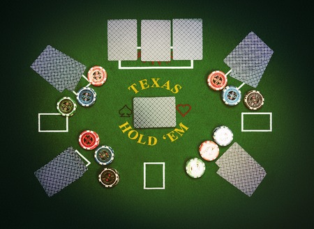 Poker cards and chips lying on green poker cloth. Texas Hold'em.の写真素材