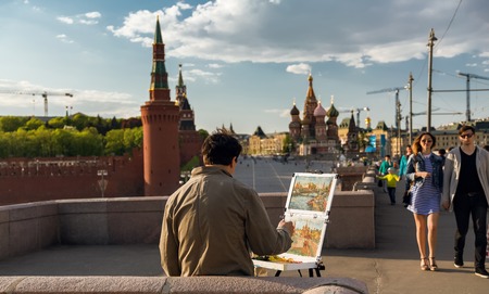 May 9, 2015. Moscow, Russia: Street artist painting Red Square in Moscow.のeditorial素材