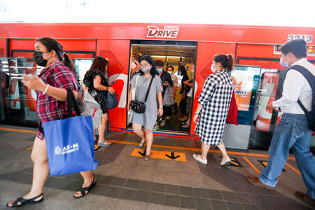 Bangkok, Thailand March 25, 2020. A passengers on a BTS train wear face masks to protect themselves...