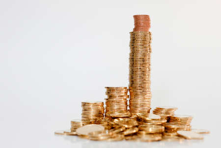 stair-shaped gold coins on white background