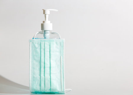 Hygienic face mask and  Sanitizer hand gel.
 cleaners for anti virus on White Background,  to preventの写真素材