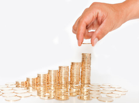 stair-shaped gold coins on white background