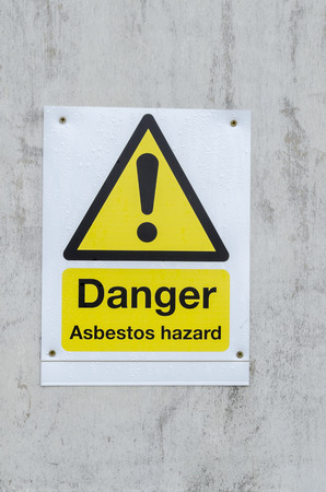 A danger sign for asbestos hazard keep outの写真素材