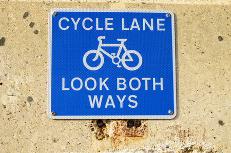 A cycle lane sign for safety look both waysの写真素材