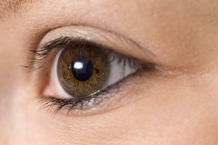 A close up macro photograph of a girls eyeの写真素材