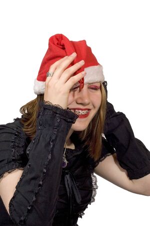 A pretty young lady in a christmas hat laughingの写真素材