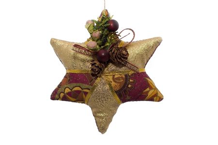 A fabric christmas ornament shaped like a star on a white backgroundの写真素材