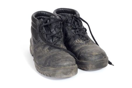 A pair of safety boots dirty after a day at workの写真素材