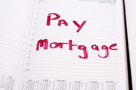 An open diary with a reminder to pay the mortgageの写真素材
